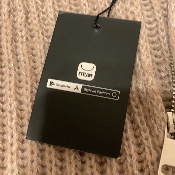 It’s a beautiful sweater with sequins in a beige color. - Picture 6 of 7